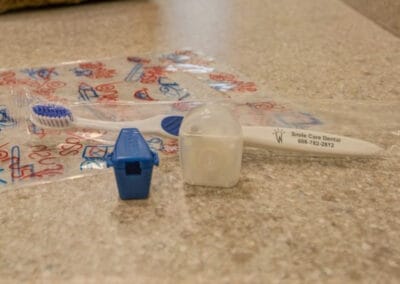 Smile Care Dental Center Toothbrush & Floss to take home